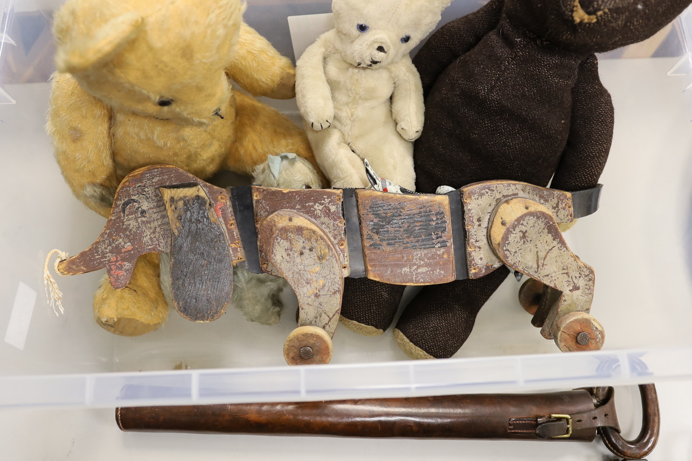 A selection of various early to mid 20th century teddy bears and toys, to include a Tri pulling wooden sausage dog